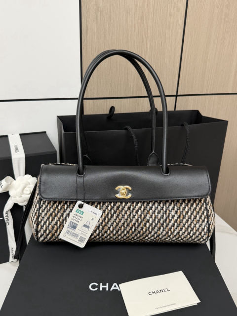 CHANEL baguette bag with lychee pattern and black bowling ball design